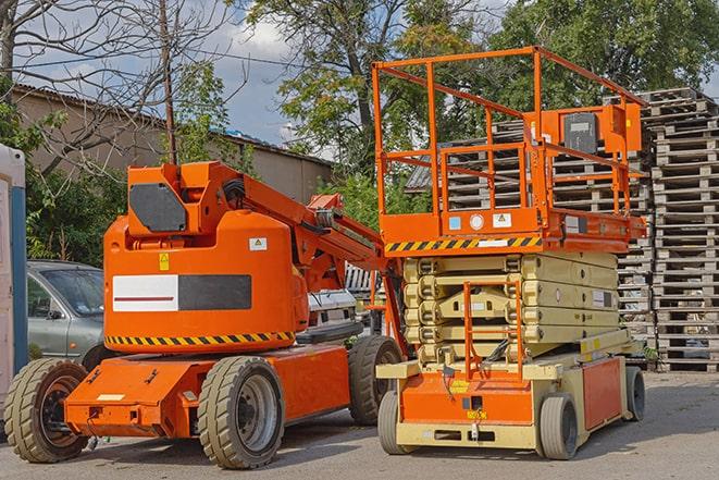 workers using forklift to load inventory in warehouse in Barrington